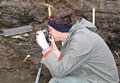 Achim Brauer in an outcrop. He documents a fossil lake sediment profile.